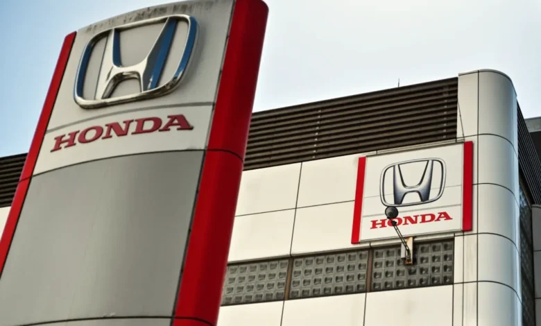 Honda posts record profit, issues cautious forecasts