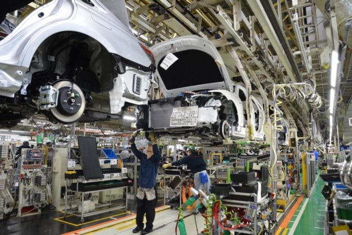 Japan Lowers Growth Forecast Amid Auto Export Slowdown